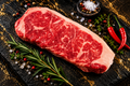 Beef striploin pieces, steak ready